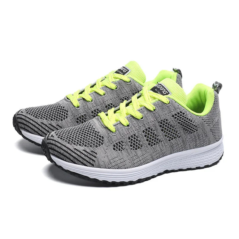 Gray and neon yellow lightweight running shoes with breathable mesh design and white soles