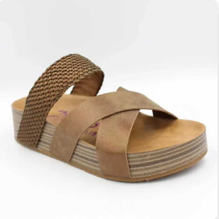 Brown women's sandal with crisscross front straps and woven back strap on platform sole