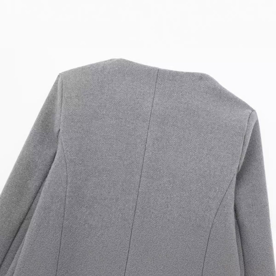 Back view of a gray wool blend coat with long sleeves and visible seam details on white background