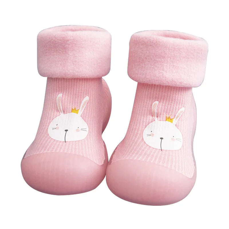 Pink baby socks with soft cuffs and cute bunny face with crown design on front