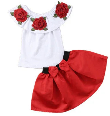 White off-shoulder top with red rose embroidery and red skirt with black waistband and bow for girls