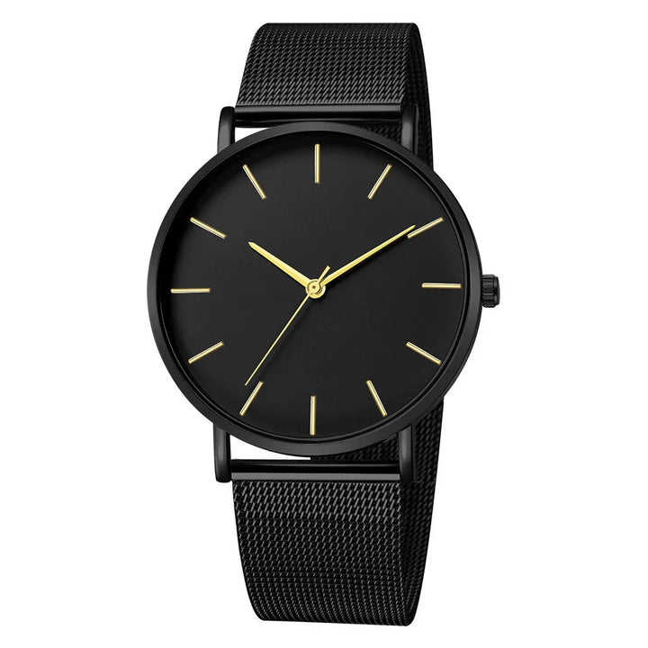 Minimalist black wristwatch with gold hour markers and mesh strap, elegant men's analog watch