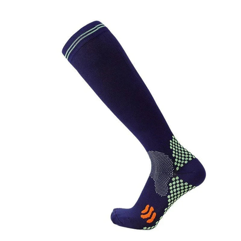 navy blue compression sock with green grip dots and orange logo on foot