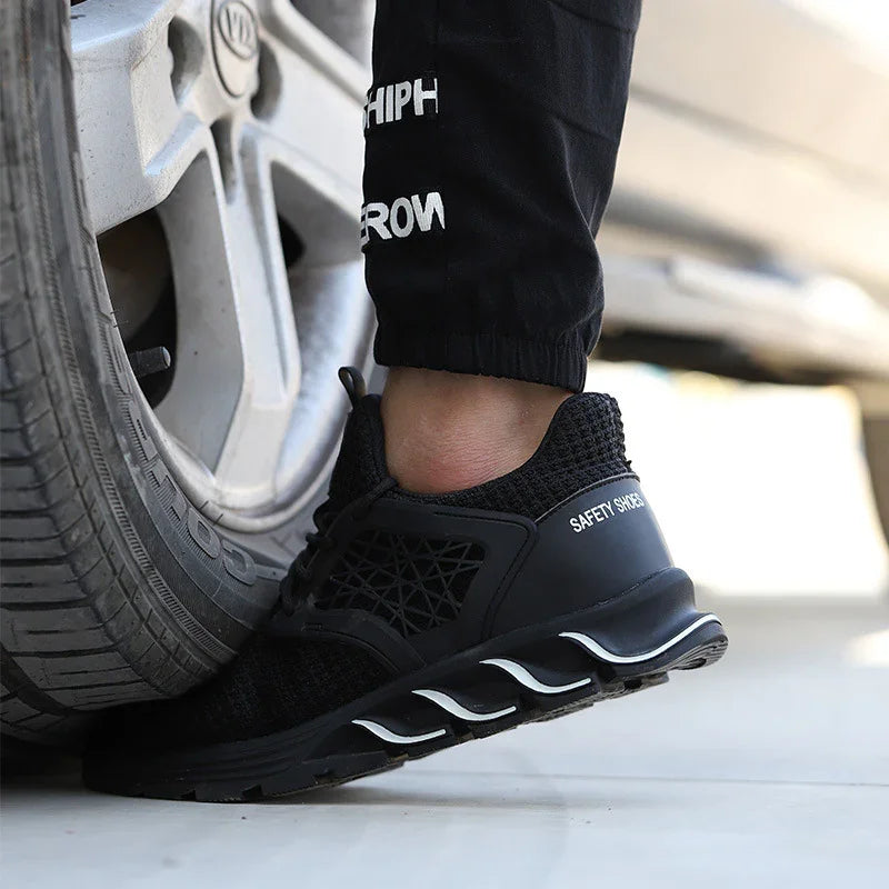 Black safety shoe crushing car tire, breathable mesh design, durable sole, black work pants