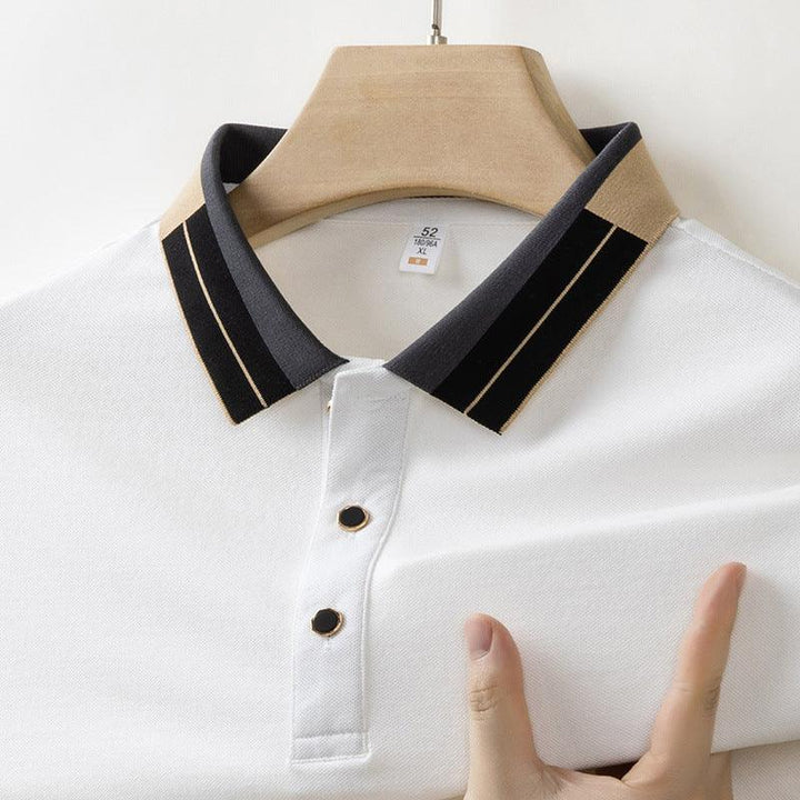 White polo shirt with black collar and beige stripes on wooden hanger, size XL tag visible