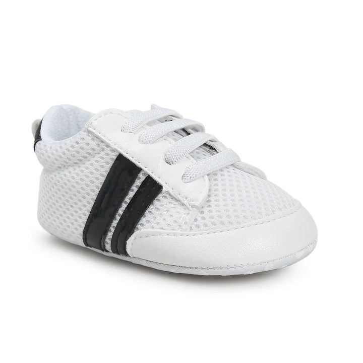 White baby sneaker with mesh upper and black side stripes on white background