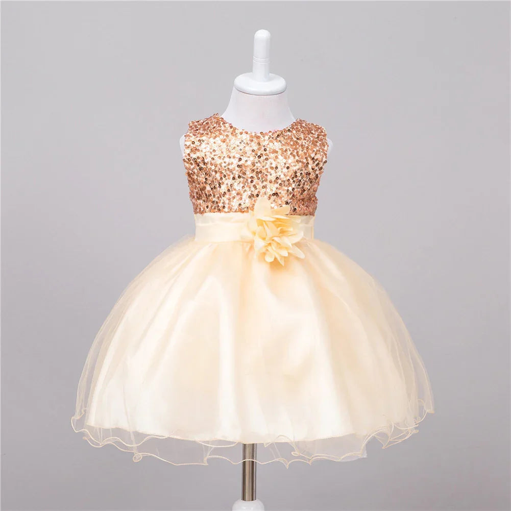 Baby girl dress with rose gold sequin bodice and cream tulle skirt with flower detail