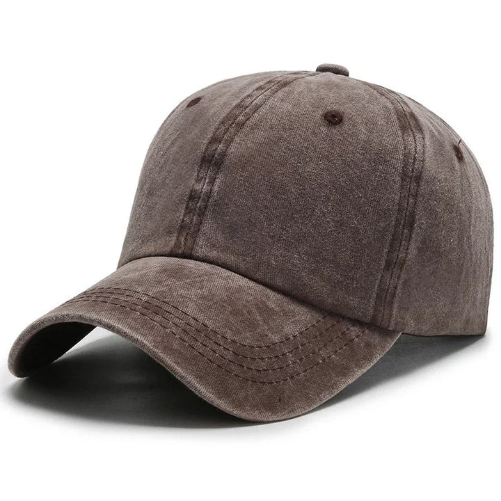 Brown washed baseball cap with curved brim and visible stitching on white background