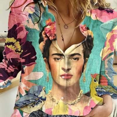 Close-up of colorful blouse featuring Frida Kahlo portrait with floral and bird patterns
