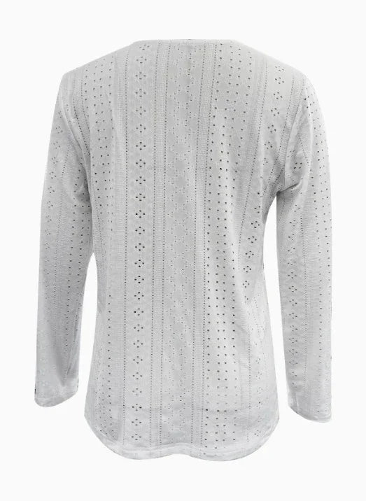 Back view of white long-sleeve eyelet knit top with vertical pattern and small holes
