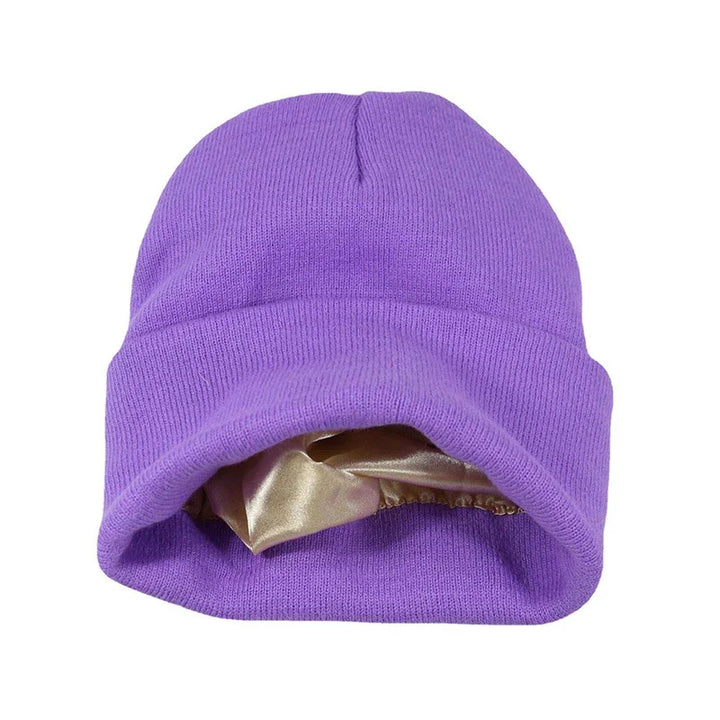 Purple knit beanie with soft satin lining inside, isolated on white background