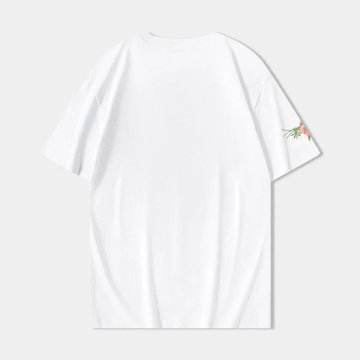 Plain white short sleeve t-shirt with small floral print on right sleeve, displayed on light background