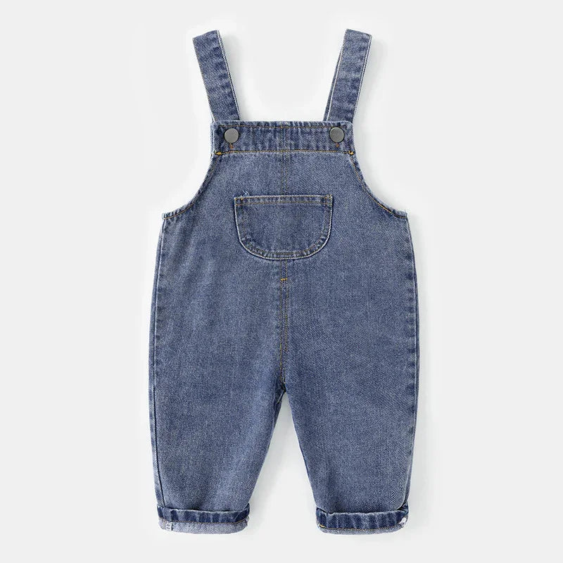 Blue denim baby overalls with front pocket and adjustable shoulder straps on white background