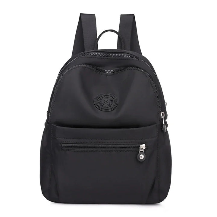 Black nylon backpack with front zip pocket and adjustable shoulder straps