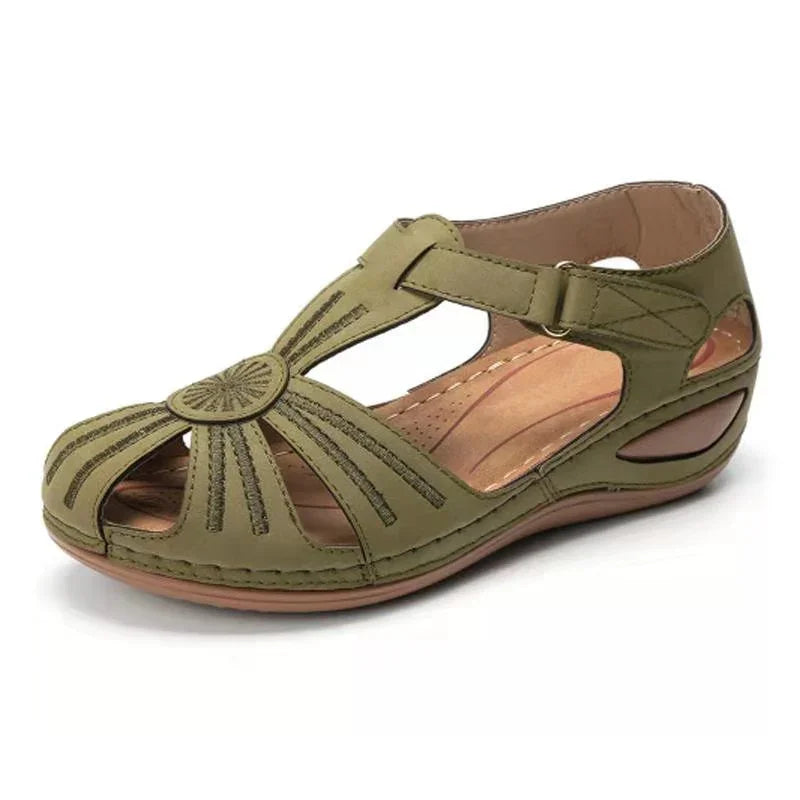 Olive green women's leather sandal with cutout design and cushioned sole on white background