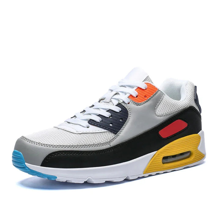 Modern multicolor athletic sneaker with white mesh, black, grey, yellow air-cushioned sole, and orange accents