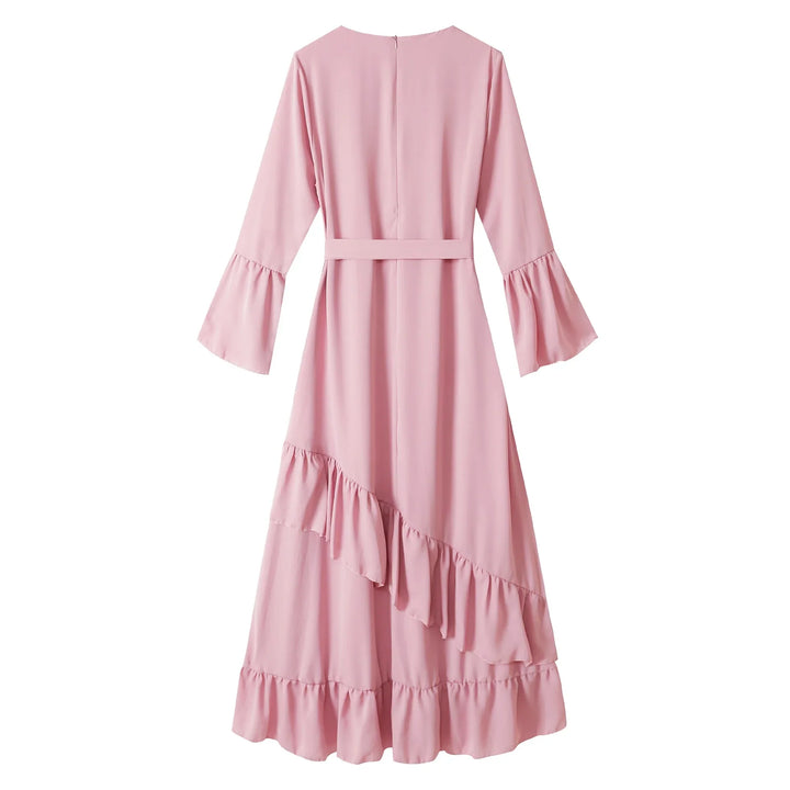 Back view of pink long sleeve maxi dress with ruffle details and belted waist