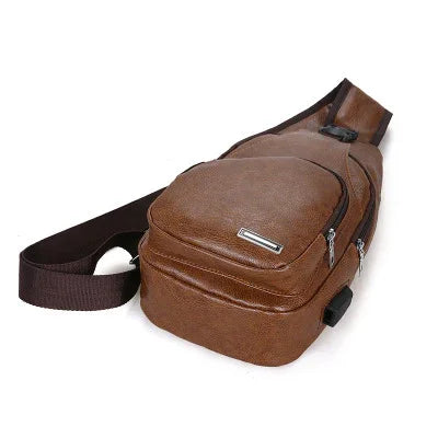brown leather sling bag with multiple zippered compartments and adjustable strap