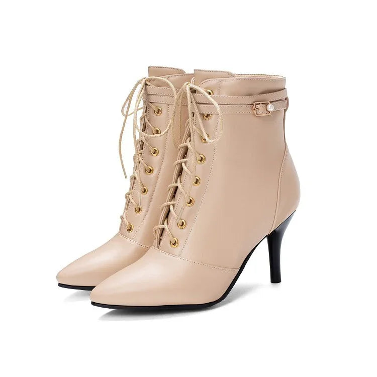 Beige leather lace-up ankle boots with gold eyelets and thin high heels on white background