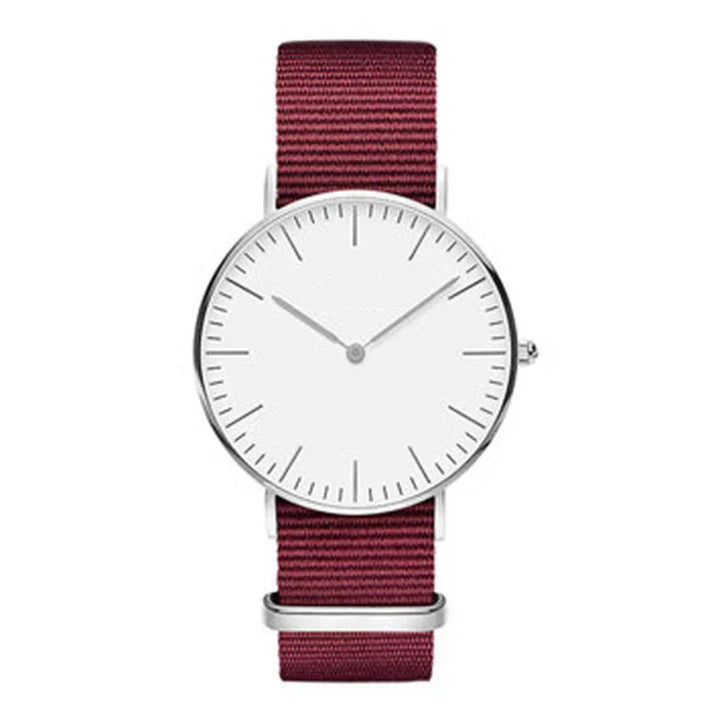 Minimalist wristwatch with white dial and silver case, featuring maroon fabric strap