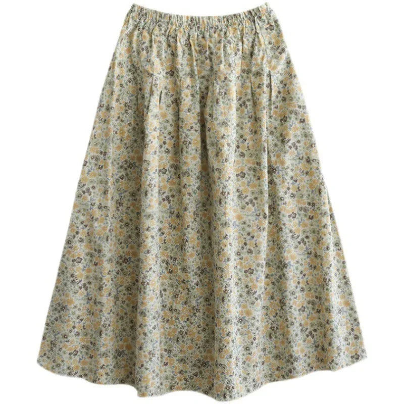Women’s A-line skirt with elastic waist and small floral print in yellow, green, and gray tones