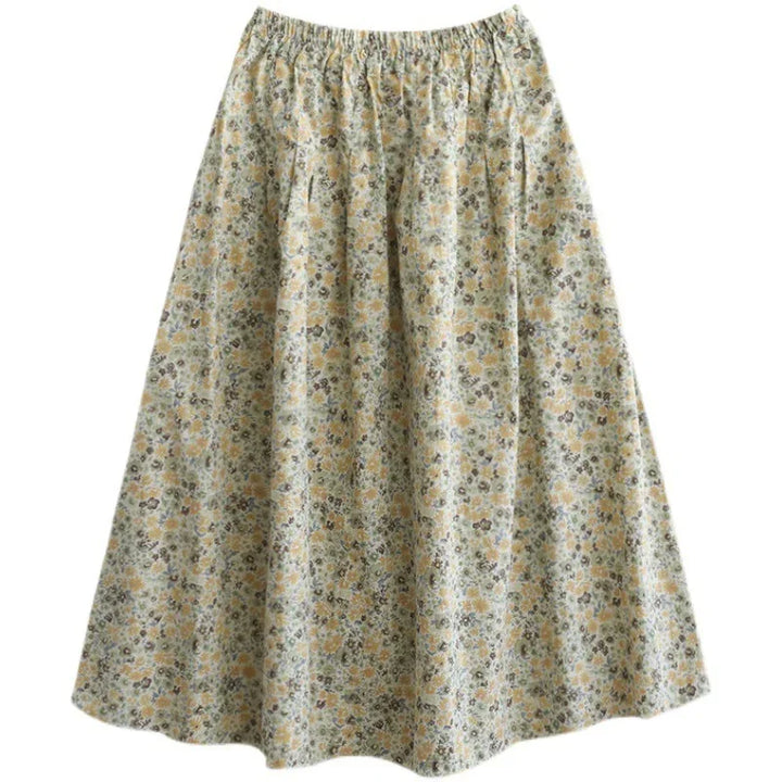 Women’s A-line skirt with elastic waist and small floral print in yellow, green, and gray tones