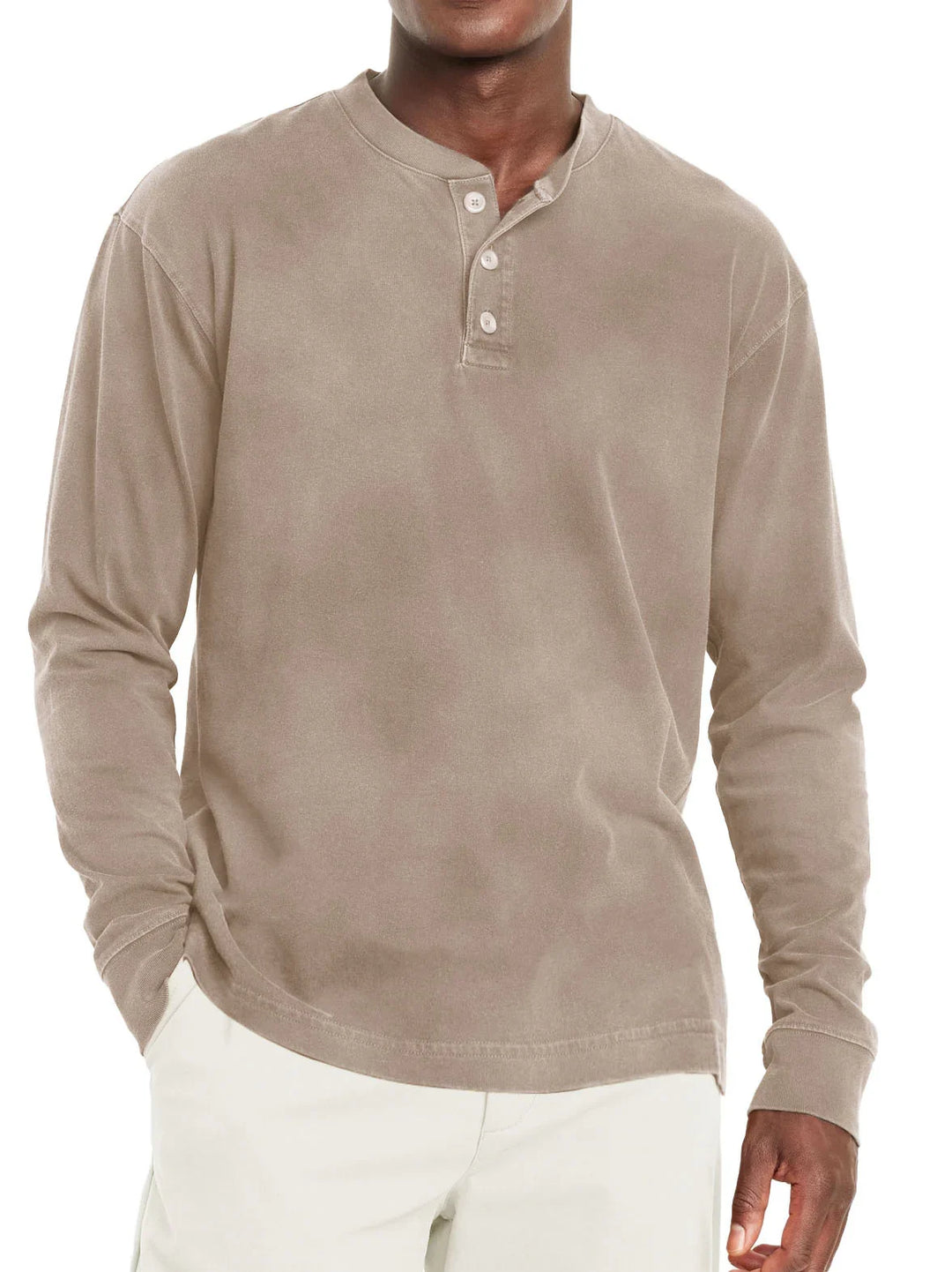 Men's beige long sleeve henley shirt with three buttons, paired with white pants