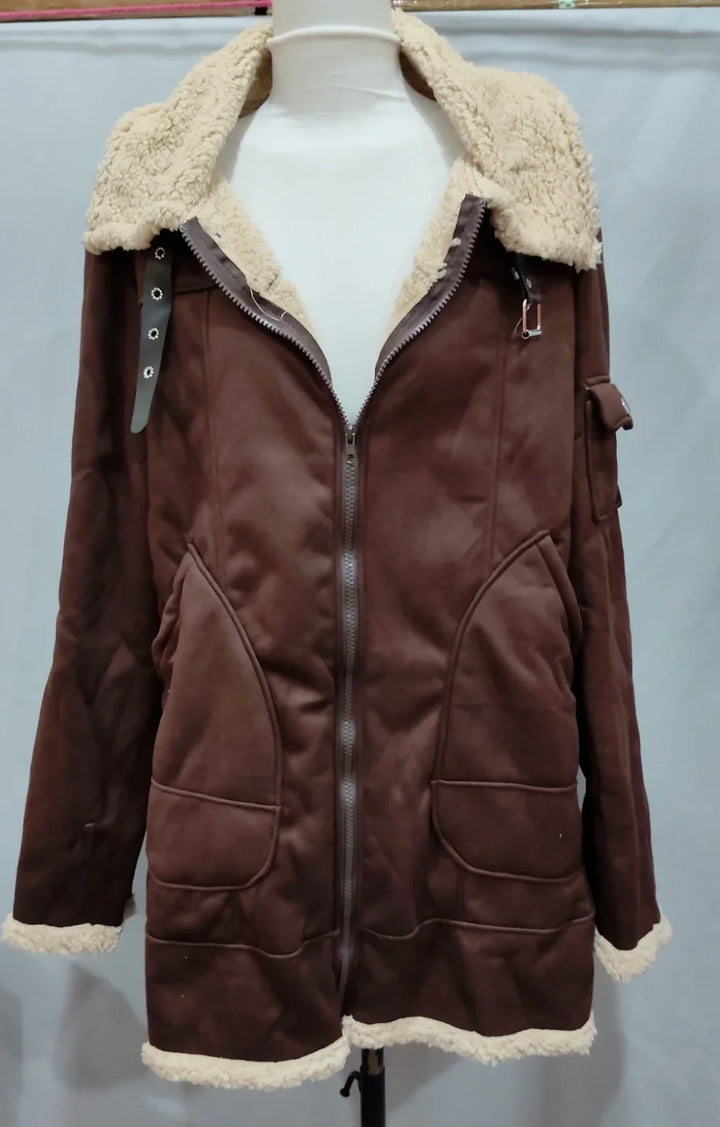 Brown shearling jacket with cream faux fur lining, front zipper, and multiple pockets on mannequin