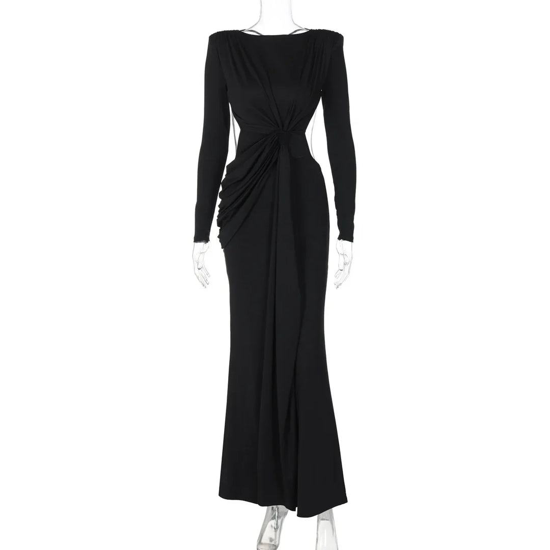 Elegant long black evening dress with ruched detailing and long sleeves on mannequin