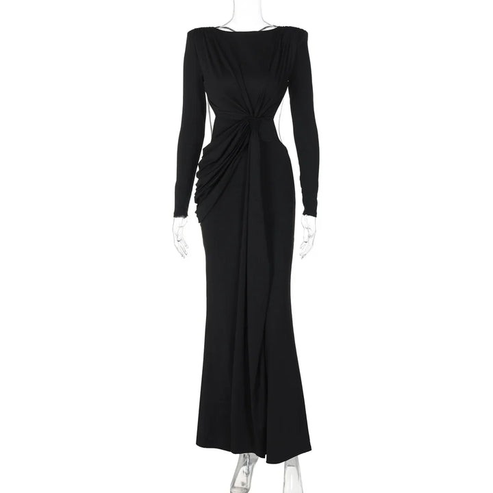 Elegant long black evening dress with ruched detailing and long sleeves on mannequin