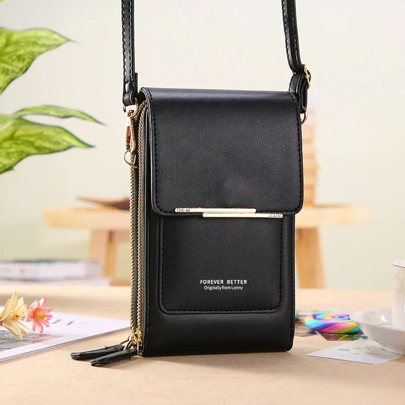 Black leather crossbody bag with gold zipper and strap, labeled Forever Better