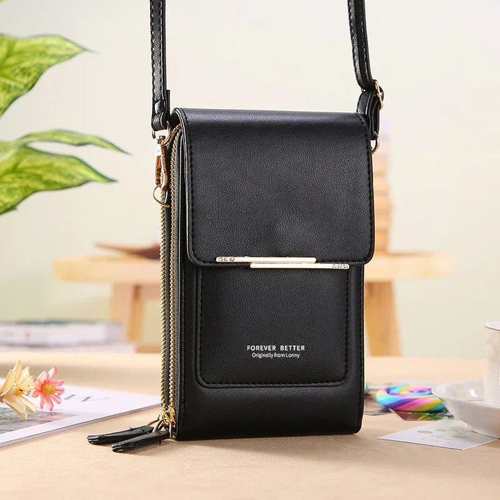 Black leather crossbody bag with gold zipper and strap, labeled Forever Better