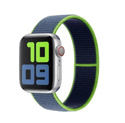 Silver Apple Watch with blue and neon green sport loop band showing green and blue digital time display