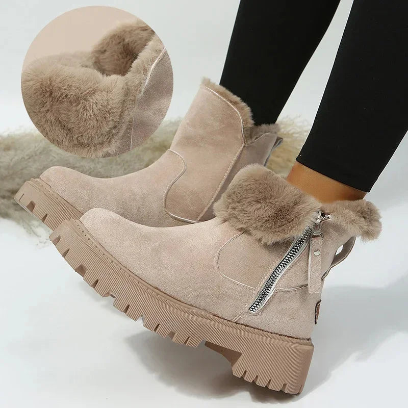 Beige suede ankle boots with faux fur lining and zipper detail worn with black leggings