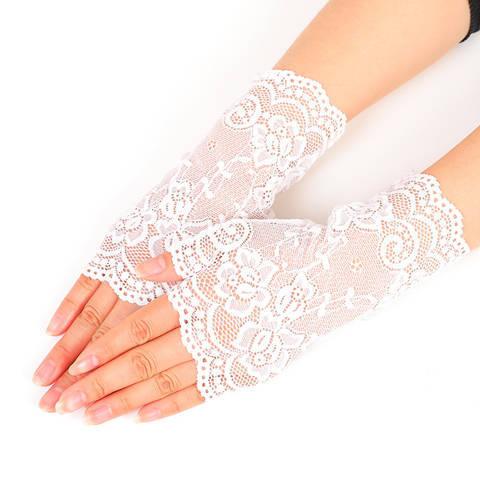 hands wearing delicate white lace fingerless gloves with floral patterns