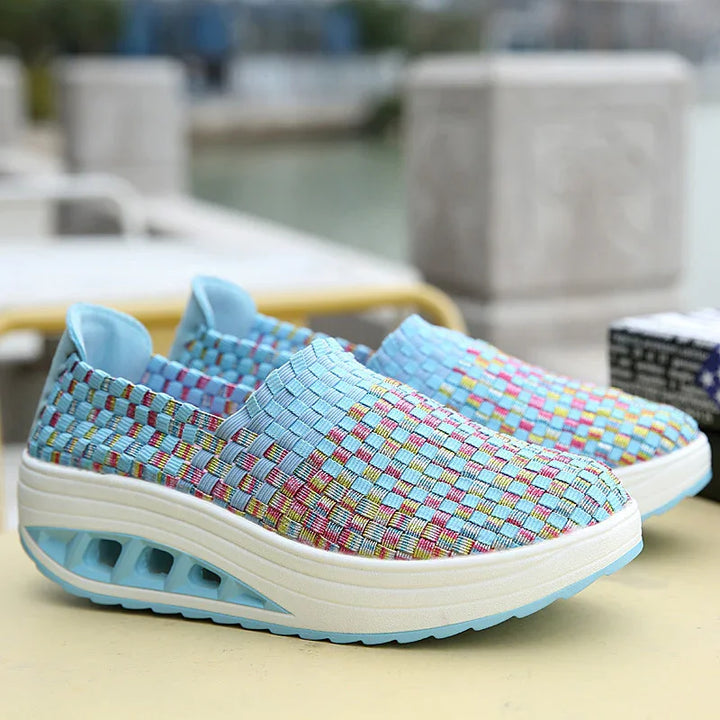 Light blue woven slip-on sneakers with multicolor checkered pattern and cushioned air sole