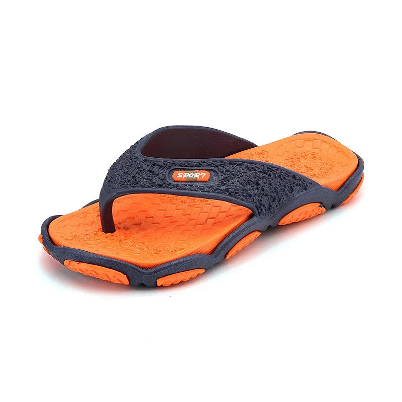 Orange and black sports flip flop sandal with textured footbed and sporty design