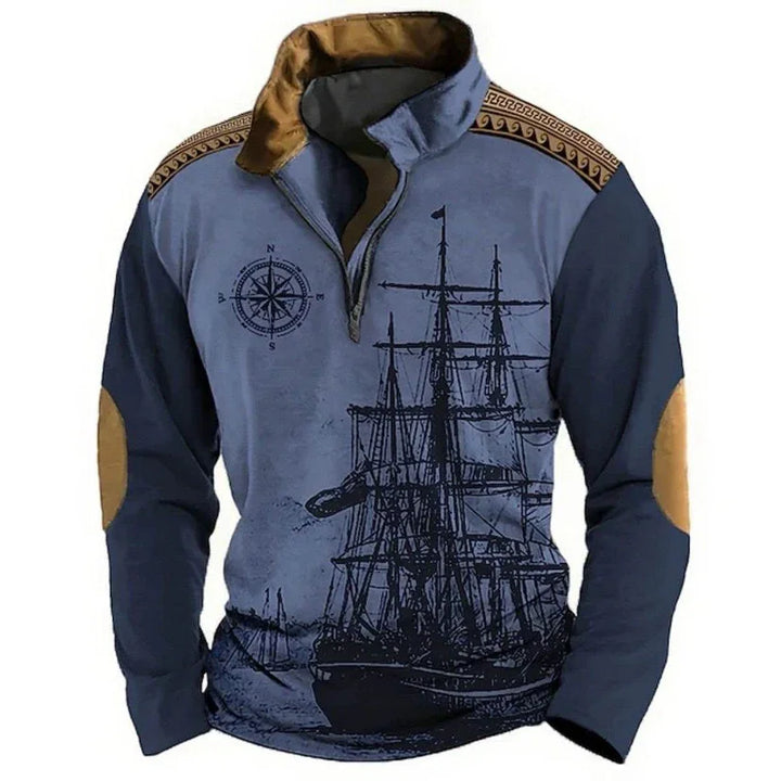 Navy blue pullover with ship graphic, compass design, brown elbow patches, and decorative collar trim