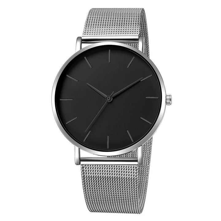 Minimalist silver mesh band wristwatch with black dial and simple silver hour markers
