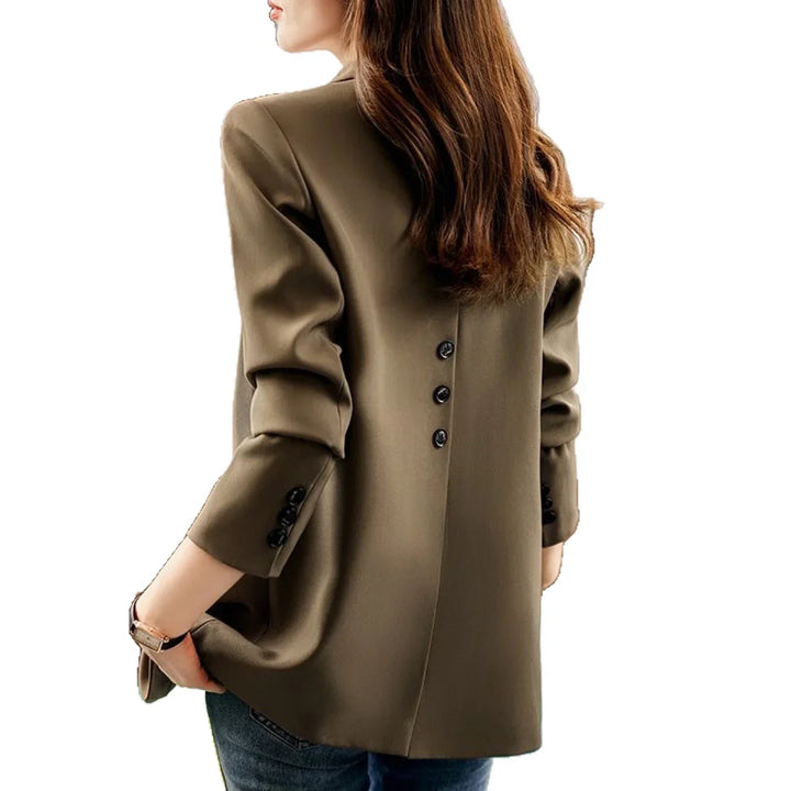 Rear view of woman wearing olive green blazer with back and sleeve black buttons