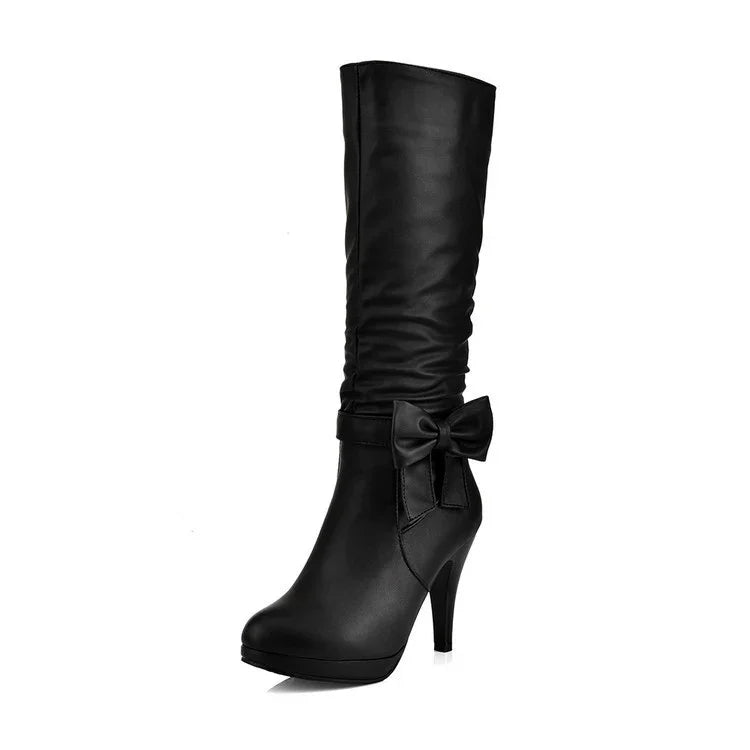 Black high-heeled knee boots with a side bow detail and ruched shaft design