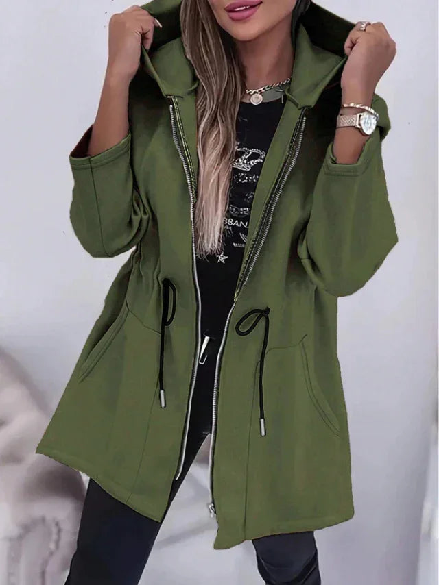 Woman wearing stylish olive green zip-up hoodie jacket with drawstrings and pockets