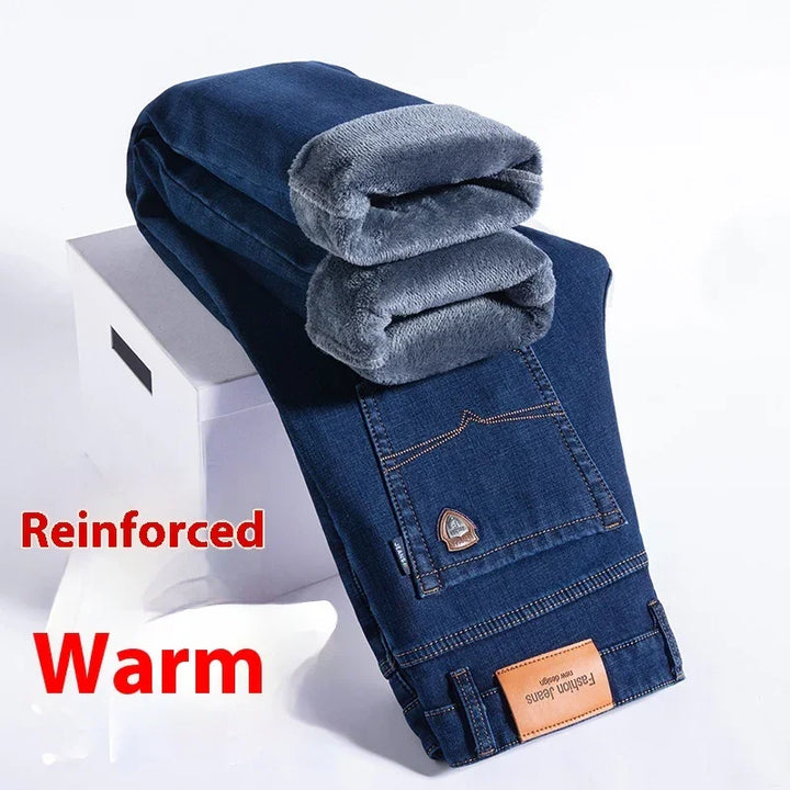 Folded dark blue reinforced warm jeans with soft gray fleece lining on white box