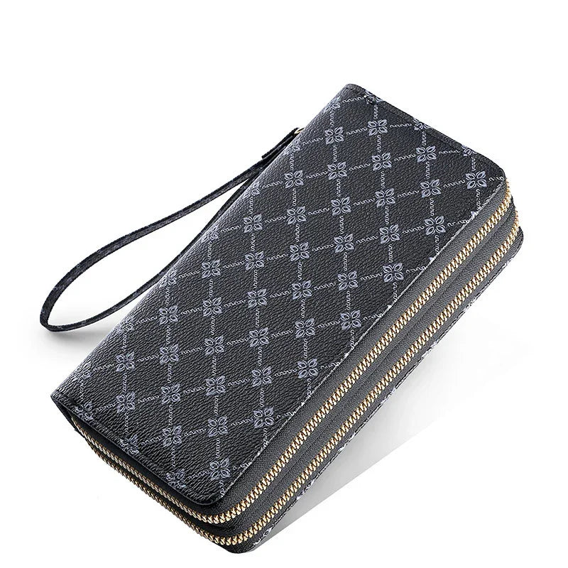 Black wristlet wallet with decorative gray stitched diamond pattern and gold zipper