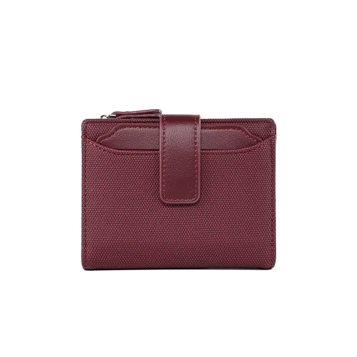 Compact burgundy textured fabric wallet with leather strap and zippered coin pouch