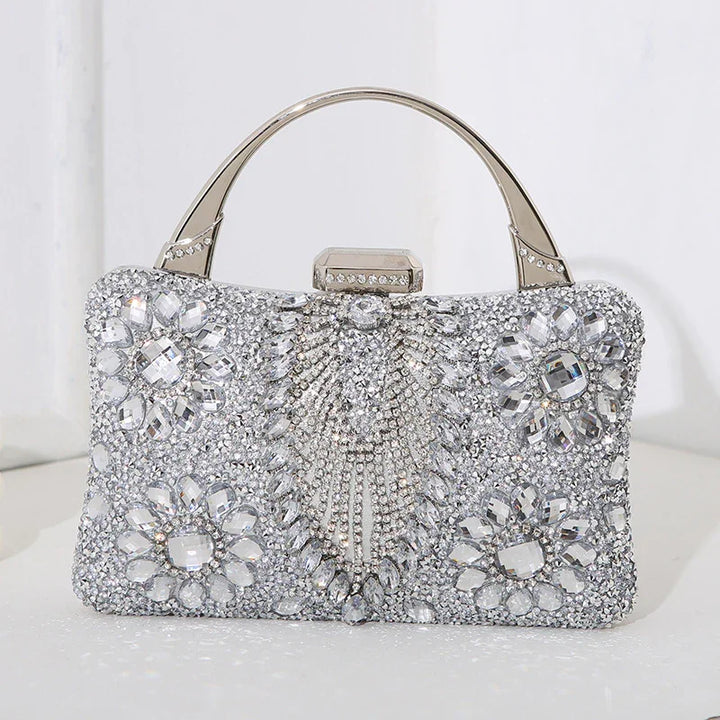 silver crystal embellished evening clutch bag with top handle and floral rhinestone patterns