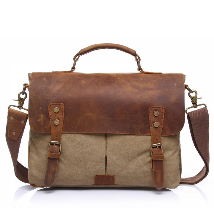 Vintage brown leather and canvas messenger bag with adjustable shoulder strap and buckle closures