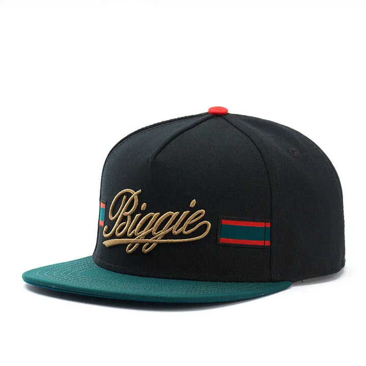 Black and green snapback hat with gold embroidered Biggie text and red-green striped accents