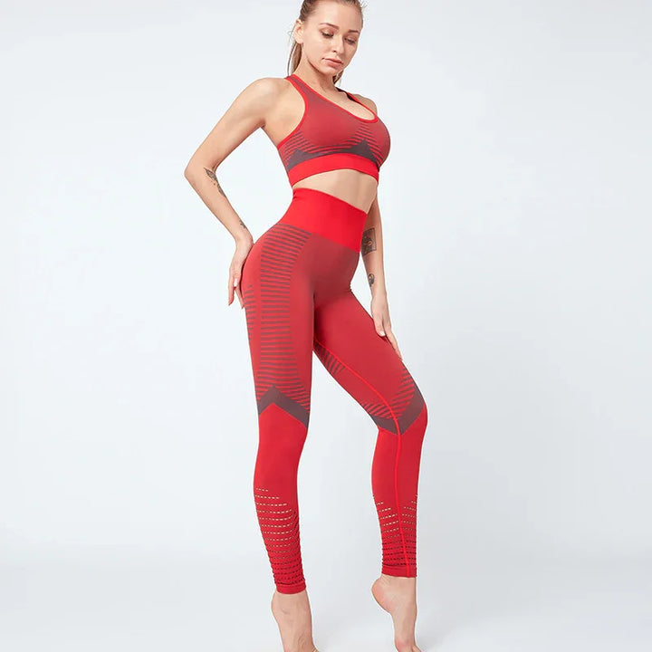 Woman modeling red and black striped seamless sports bra and high-waisted leggings activewear