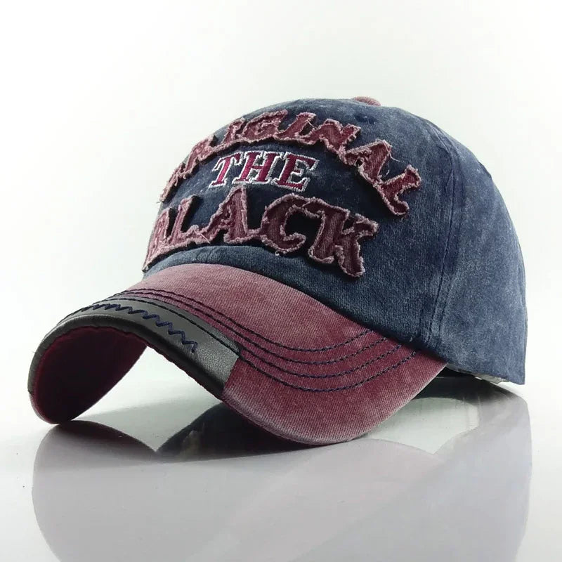 Vintage style blue and red baseball cap with distressed embroidered text 'ORIGINAL THE BLACK'